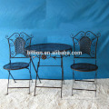 black folded wrought iron garden tables and chairs